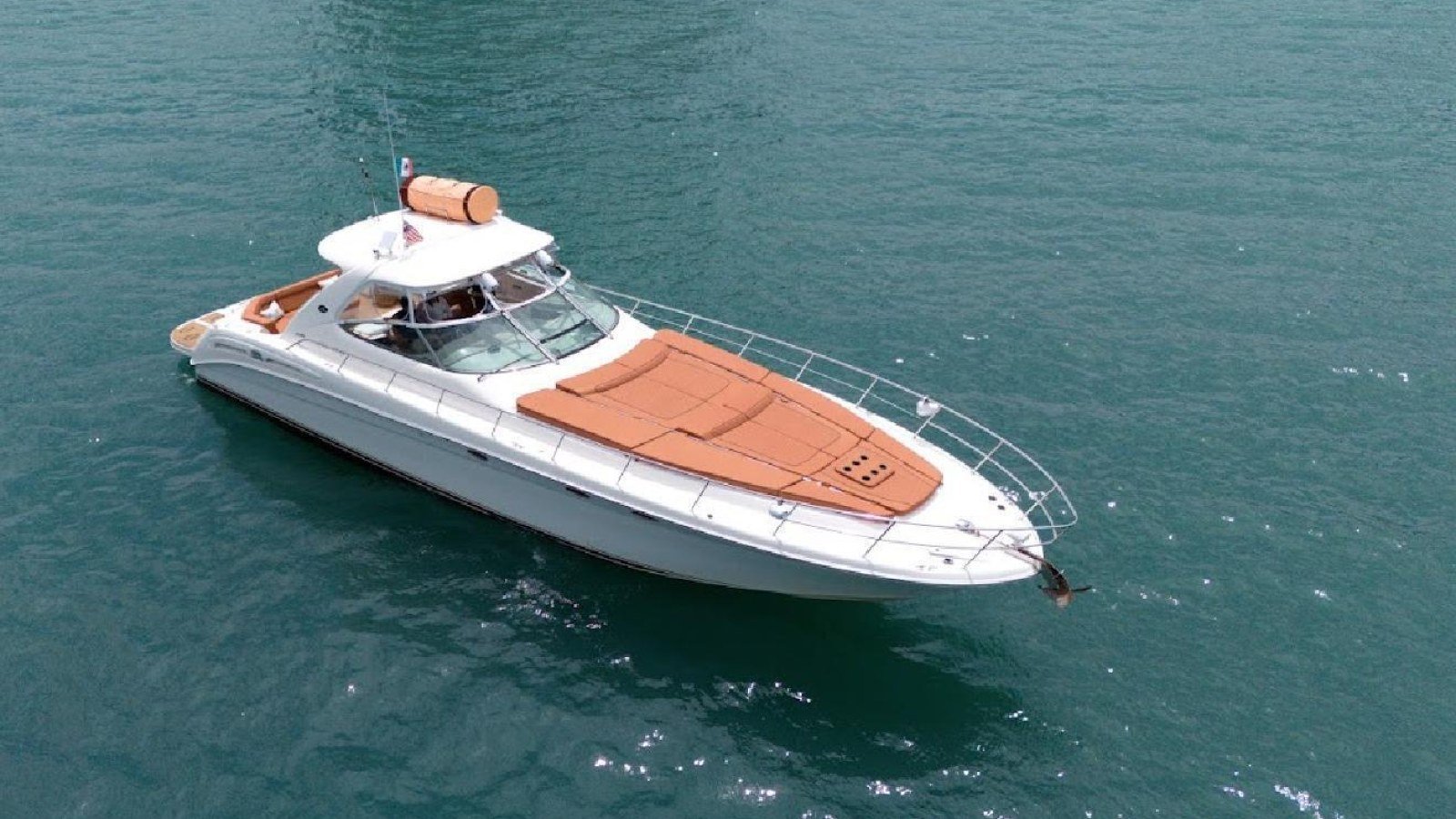 The Sea Ray 60 XL motor yacht at anchor in flat water off Puerto Vallarta, a typical first-charter boat